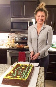 Carmen Handy cuts a cake celebrating her scholarship to the University of Vermont. Submitted Photo