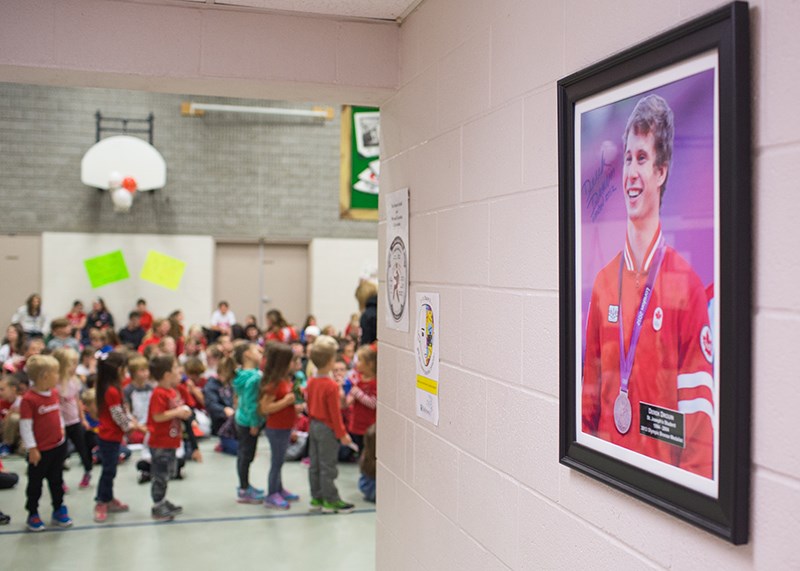 St. Joseph students line up past a photo of Olympic gold medalist Derek Drouin to meet him in person. Troy Shantz