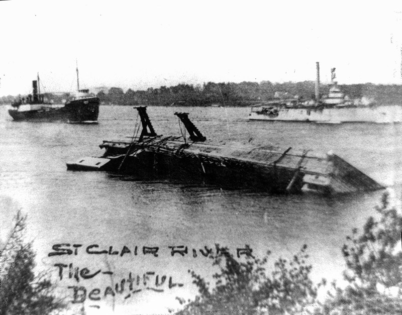 The Province capsized in the St. Clair River on Sept. 28, 1923, with the loss of three lives. This photo shows the ship being righted by commercial salvagers, who placed the "righting arms" onto the wreck. The commercial traffic on the river was fairly heavy in those days, as seen in this photo, with two, large ships passing the wreck. Photo courtesy, Moore Museum