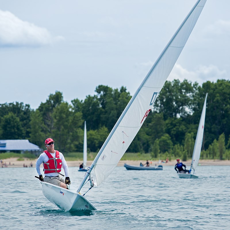 Competitor Steve Lacey of the Sarnia Yacht Club balances his Laser sailboat offshore of Canatara Beach. Competitors at the regatta covered a wide range of ages and experience levels. Troy Shantz