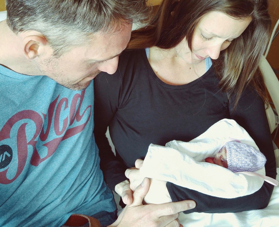 Chris and Amy Reinders with their baby girl, Charlotte.Submitted Photo