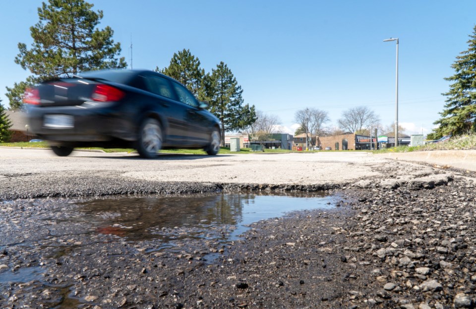 road repairs roads potholes