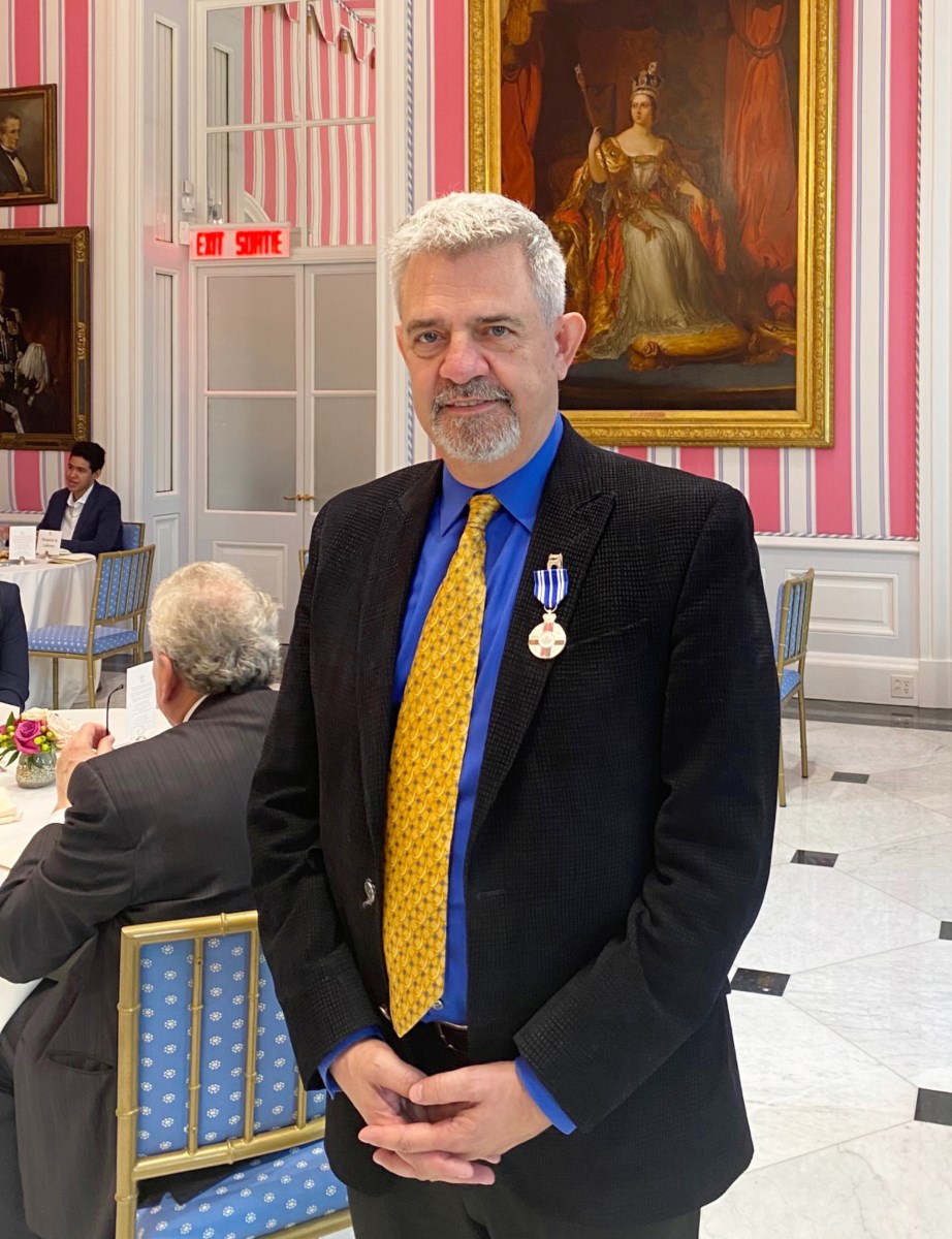 Alex Mustakas wearing his meritorious service medal at the Rideau Hall reception