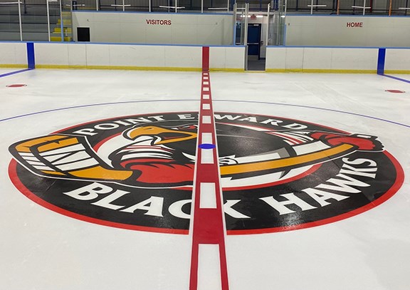 New logo for the Point Edward Black Hawks at centre ice.