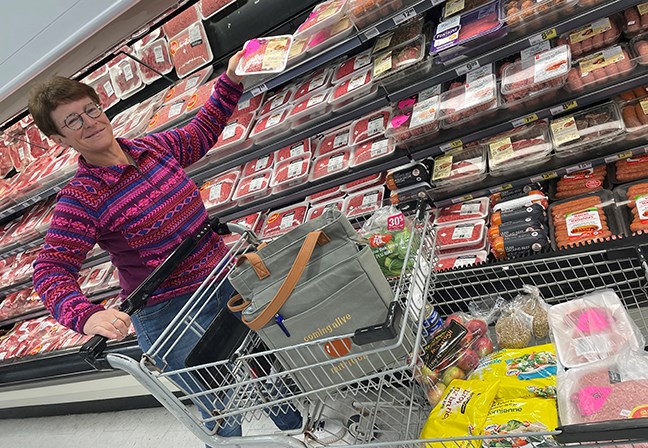 Nutritional consultant Cathy McRae buying discounted meat. (Cathy Dobson photo)