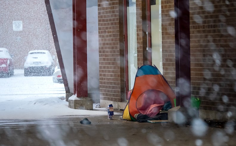 A Sarnia resident found refuge under a, awning in downtown Sarnia .