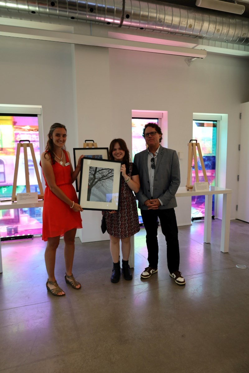 isis-belleman-mckeegan-center-is-awarded-the-grand-prize-for-the-2024-teen-photo-contest-by-vanitia-campbell-left-and-richard-beland-right
