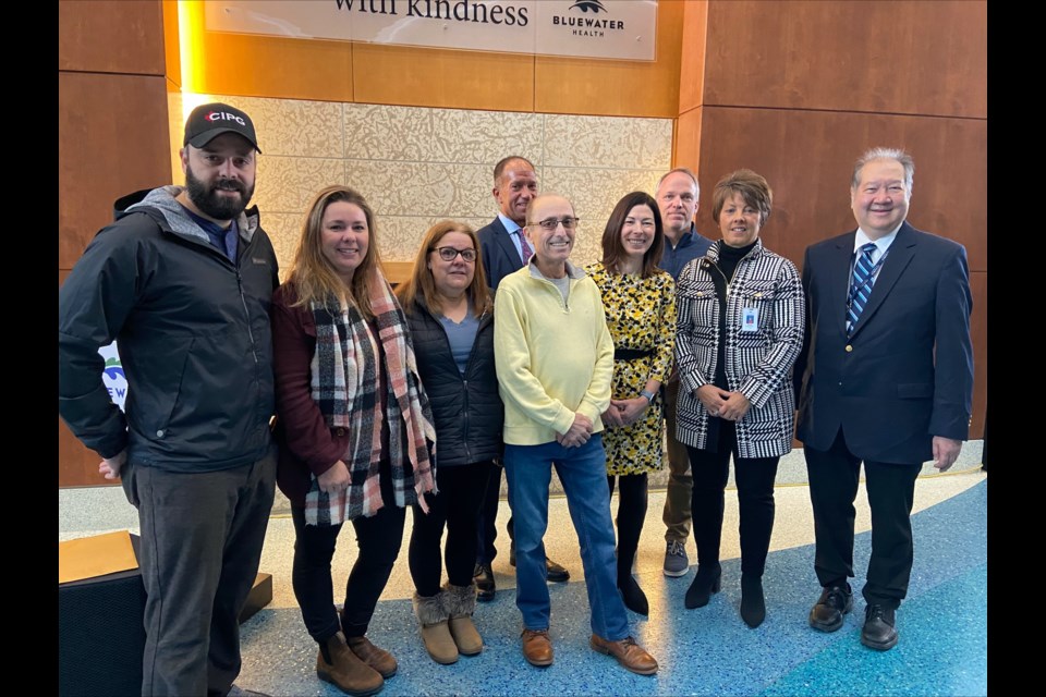 A Bluewater Health oncology patient and his family, along with NOVA, Bluewater Health, and Bluewater Health Foundation leaders.