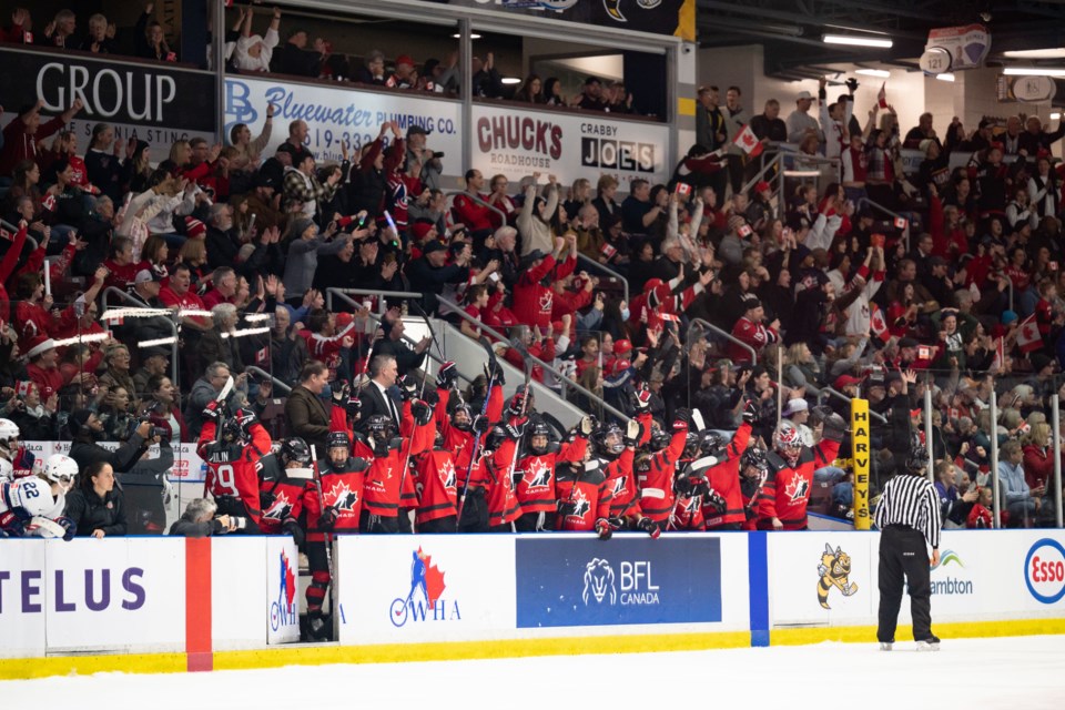 Team Canada celebrates a thrilling 3-2 shootout victory at the Progressive Auto Sales Arena, Saturday, Dec. 16.