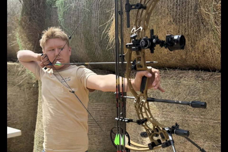 Liam Townsend of Preeceville proudly showed off his bow courtesy of Preeceville Archery and Hoyt. Photo by Billiejoe Townsend