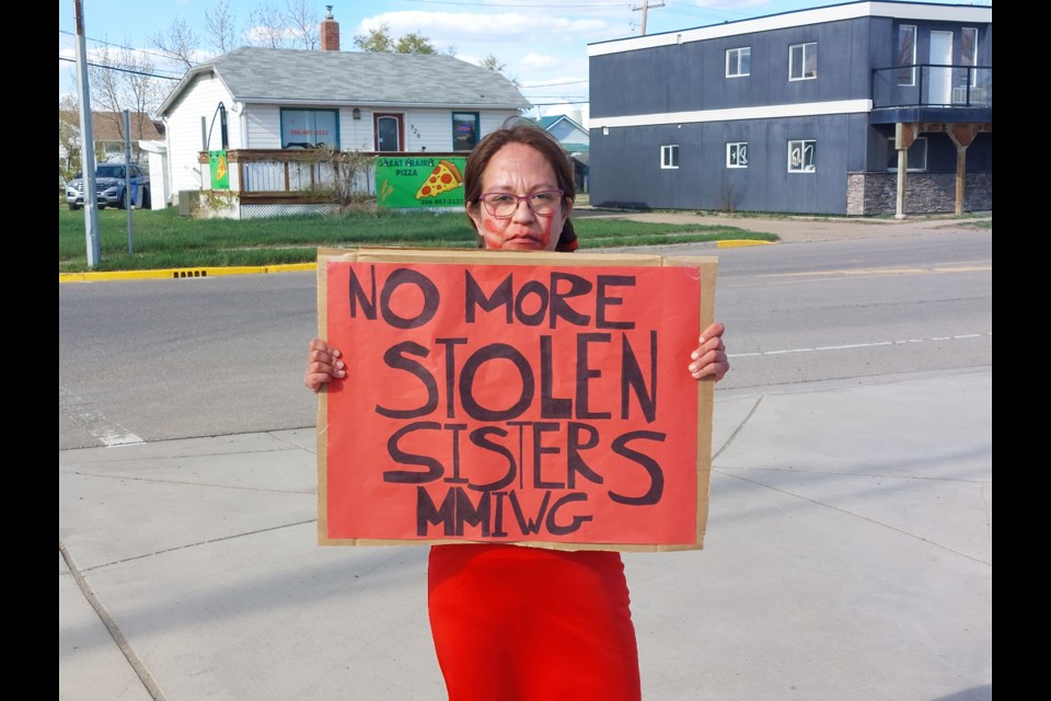 Kaytlyn Stevens stood at the fourway stop in Outlook all day. Photo by Derek Ruttle.