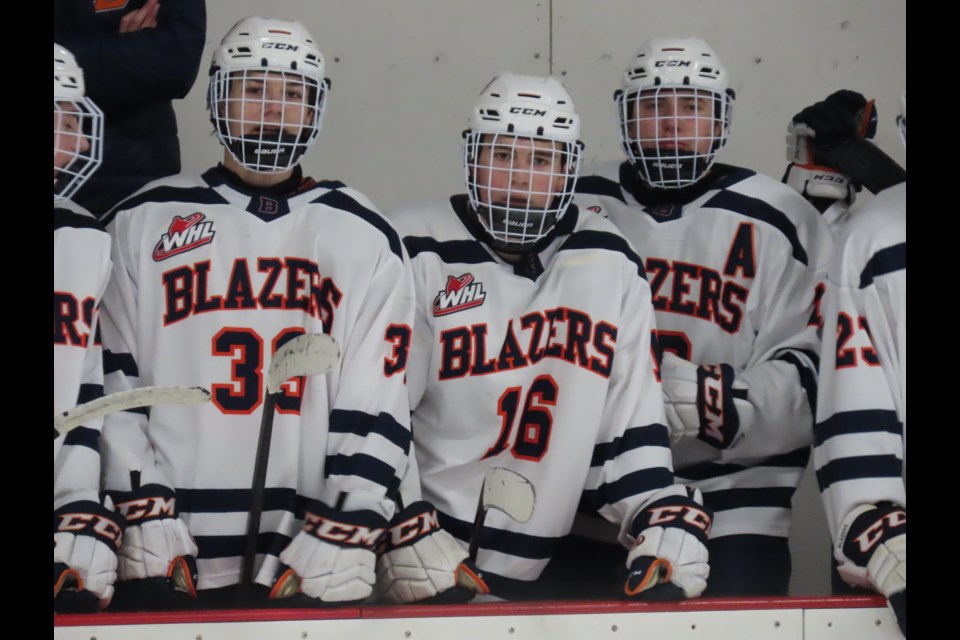 #16 Cole Peardon watches the game intently before another shift on the ice.