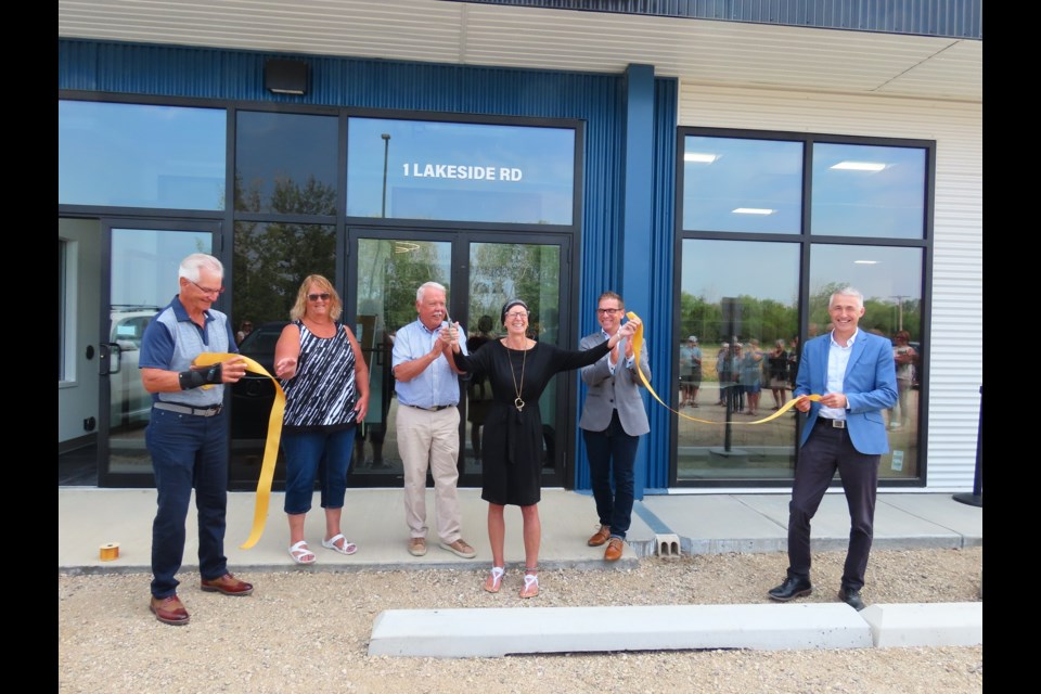 Village of Elbow mayor Colleen Hoppenreys is all smiles after cutting the ceremonial ribbon the Harbor Golf Community Center. Photo: Derek Ruttle/The Outlook