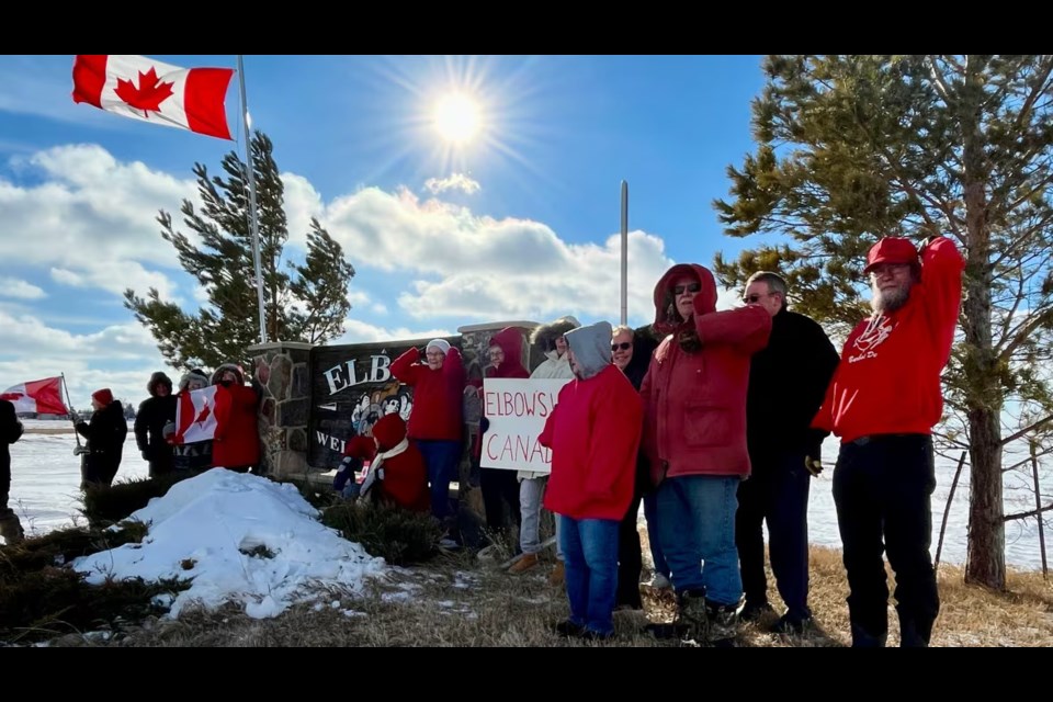 Residents grouped together and got their 'elbows up' in standing in solidarity. Photo by Jeremy Warren/CBC News.
