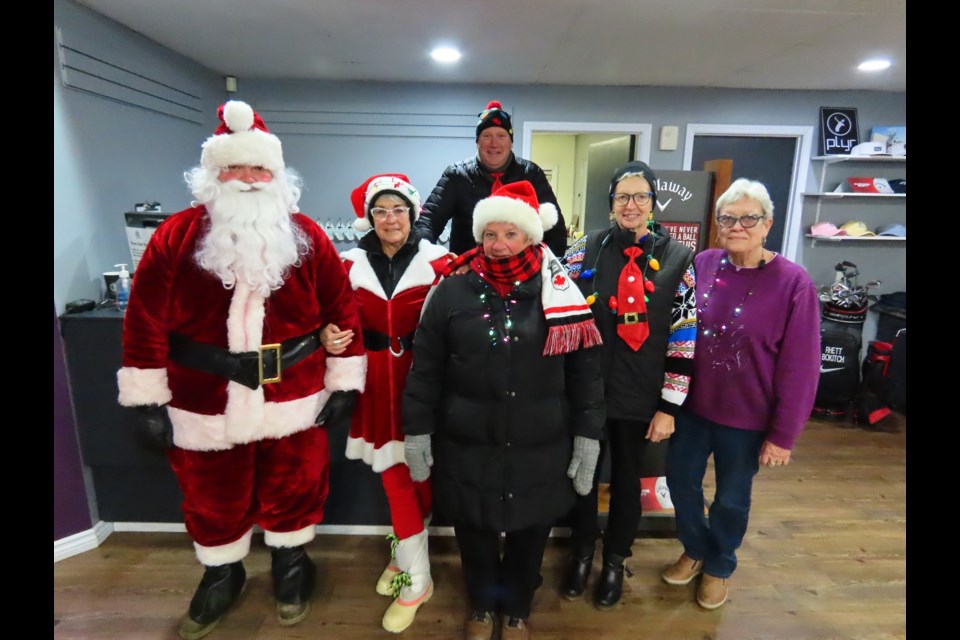 The gang at the Harbor Golf Club was ready to hand out treats and hot chocolate.