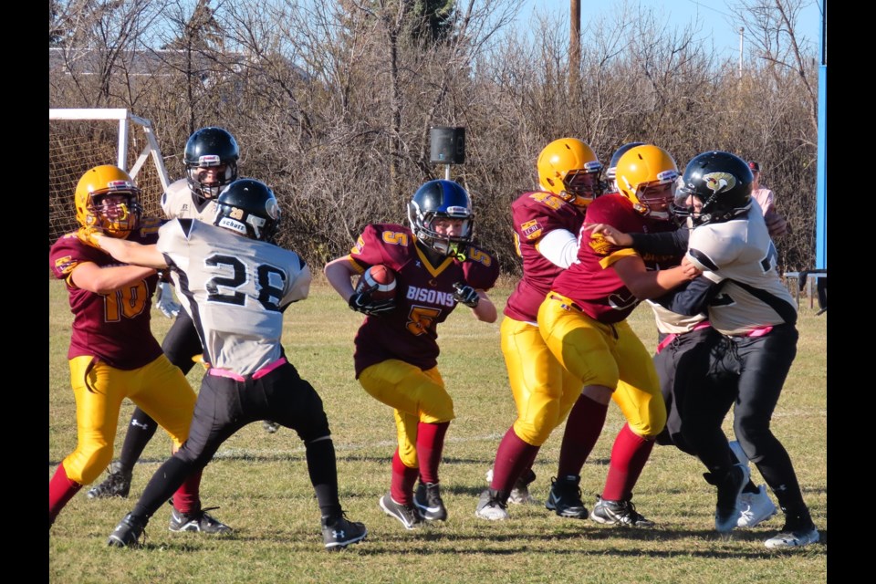 LCBI #5 Christopher Stadler dashes through with the ball in action against Kindersley. Photo: Derek Ruttle/The Outlook
