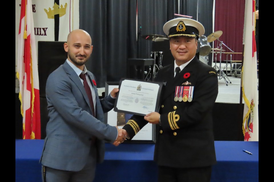 LCBI High School teacher Andriy Prokopchuk and Lt. Commander Michael Su with his Certificate of Enrolment. Photo by Derek Ruttle.