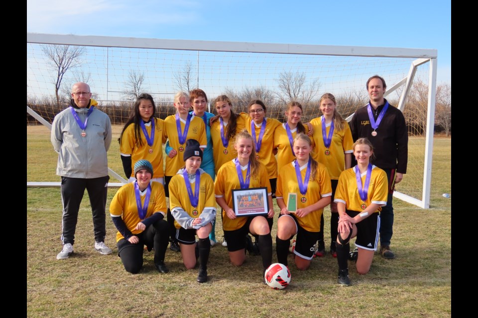 The team posed with their Bronze medal after their final game on Saturday.
