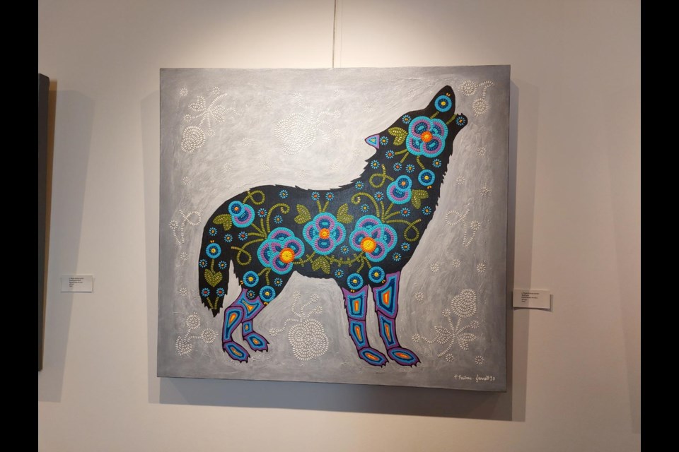 A wolf stands out as one of the many subjects on display at the Outlook gallery. Photo by Derek Ruttle.