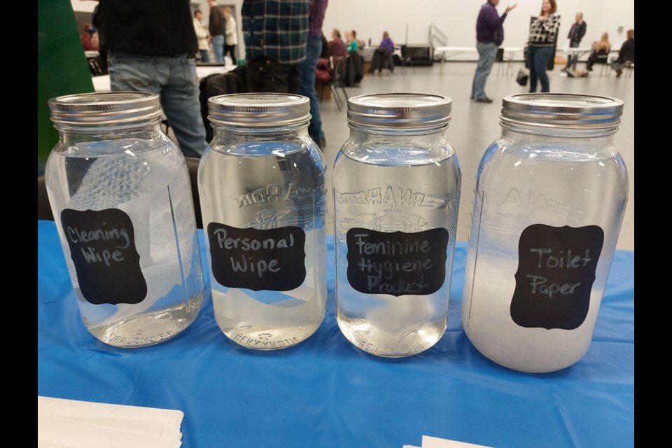 Jars filled with town water showed how some materials do and don't break down. Photo by Derek Ruttle.