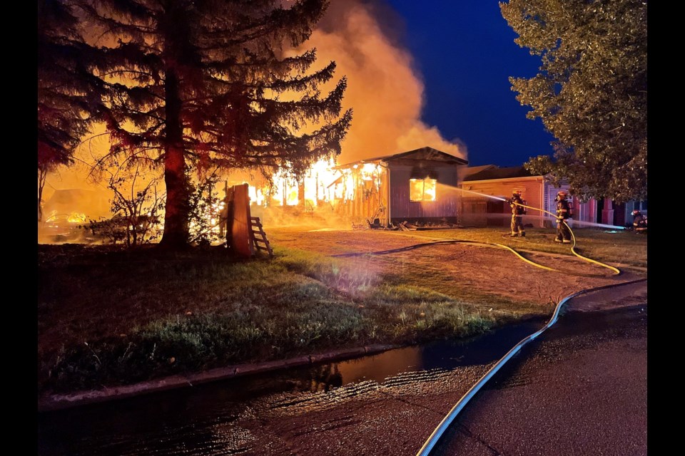 One person died as a result of the fire that also destroyed two trailers.  Photo provided by Sgt. Mark Langager/Outlook RCMP.