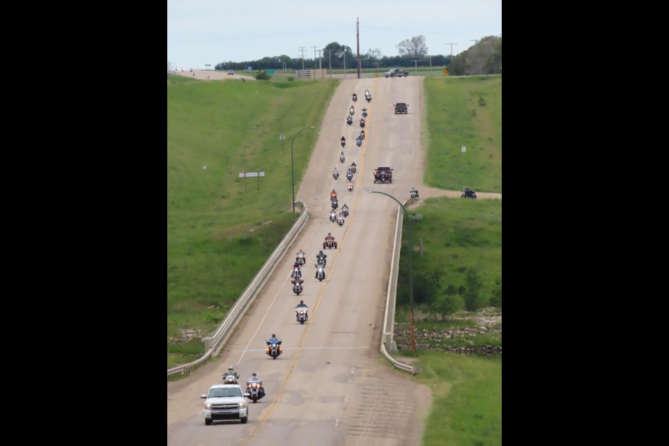Watching the bikes come down the hill across the bridge was a sight to see. Photo: Derek Ruttle/The Outlook