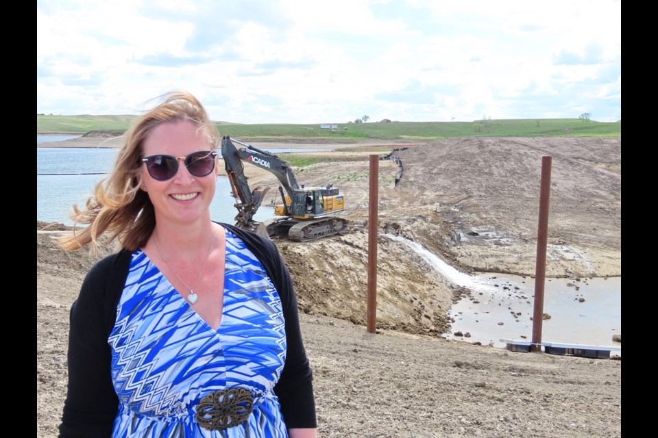 Sandy Shores Resort owner & developer Rauncie Kinnaird was ecstatic to see the ground open up and watch the water spill over into the marina.