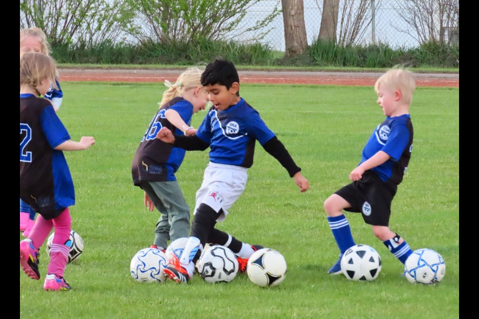 Even the youngest of players are enjoying learning the sport of soccer. Photo by Derek Ruttle.