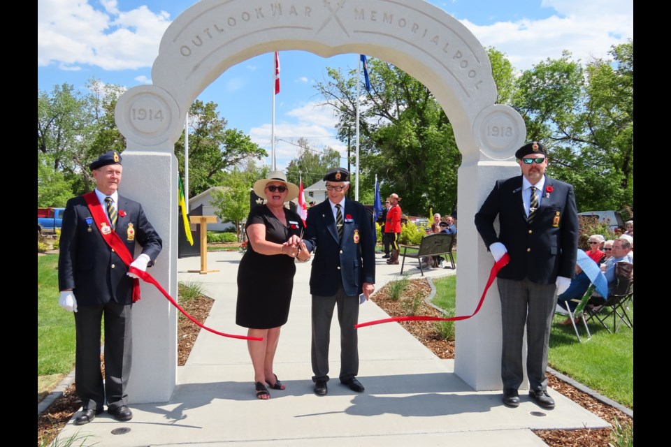 Outlook mayor Maureen Weiterman cuts the ceremonial ribbon with John McPhail to mark the opening of the park.