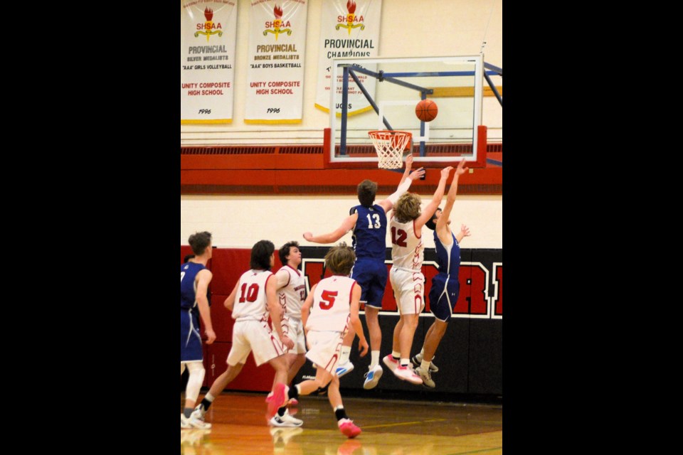 Jumping for a rebound are players from Moose Jaw 
Cornerstone along with the Warriors’ Ethan Stifter. 
Also in the photo are Warriors Cooper Lewin, Zander Willy and Garret Brebner.