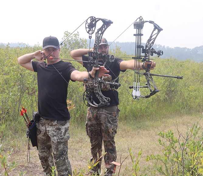 At the Assiniboine River Archery Club 30th annual 3D shoot on Aug. 10, Dawson Zuravloff (left) and Andrew Owchar of Canora looked like they were having a good time trying to outdo each other. 