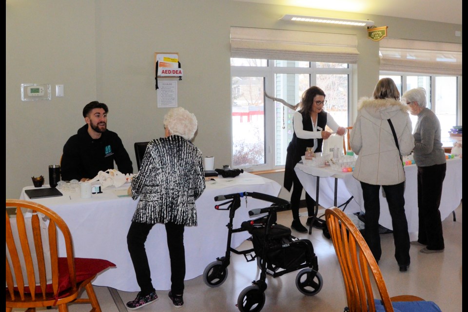 Donna Boser-Kelly, centre, sells some speciality skin care products to a customer, while Dr. Lyndon Jellison, left, speaks with a senior about services provided at Longevity Chiropractic & Wellness during the Health and Wellness Expo hosted at Parkview Place in Unity, March 23.