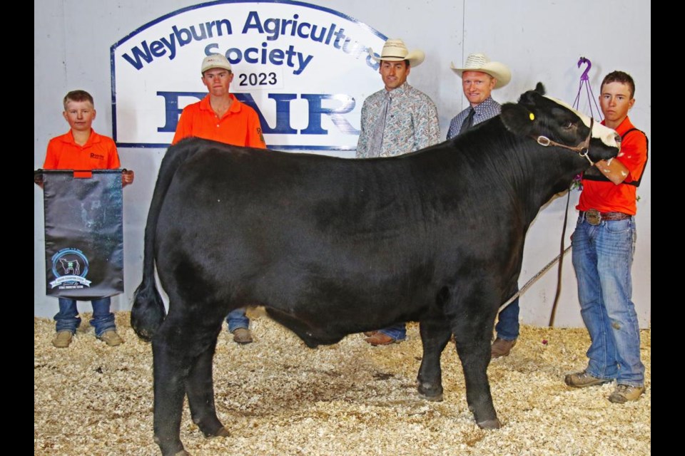 The Grand Champion Steer was shown by Rylan Fladeland of the Radville 4-H Beef Club. Standing behind the champion steer are Rylan's brothers, Brayden and Dawson, and the judges, Joe Barnett and Aaron Birch.