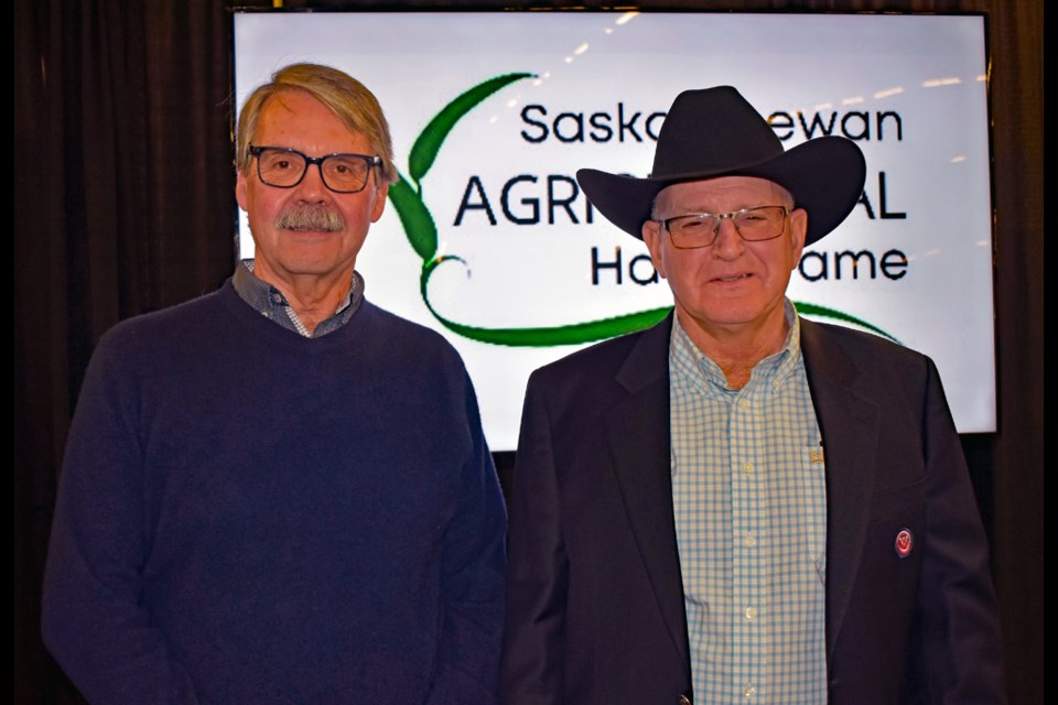 Dr. Laurie Tollefson, left, with Saskatchewan Agricultural Hall of Fame president Reed Andrew.
