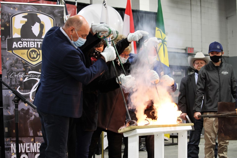 Canadian Western Agribition president Chris Lees, joined by members of the Sutter family, performed the annual Burning of the Brand ceremony to open the week’s events.