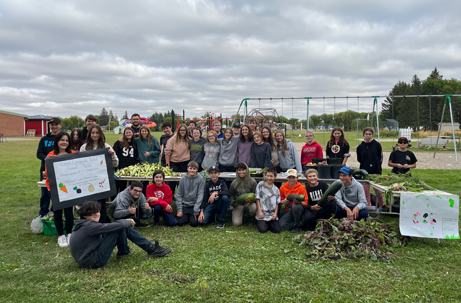 This group of Grade 8 students put in many hours of looking after the CCS garden and harvesting vegetables, and then taking care of customers at the CCS Farmer's Market on Sept. 15. From left, were: (standing) Brayden Fediuk, Silver Nordin, Layna Pettigrew, River Kozmanuik, Heidi Mentanko, Storey Fehr, Derek Serdachny (vice-principal), Josie Mirva, Xavier Brock, Natalie Kosar, Saphire Peepeetch, Paisley Wolkowski, Luca Propp, Jacob Lowes, Natalie Pshyk, Jacob Rostotski, Danielle Dutchak,  Ferlyn Brass, Kaelyn Shukin, Heidi Parmley, Rhianna Stefanyshyn, Merrick Derkatch, Mia Bartscher, Zoey Brodeur and Wyatt Murray; and (front) Jayden Lepine, Teagan Jones, Matthew Knox, Chase Curtis, Jordan Zbitniff, Liam Trask, Jordan Insko, Jackson Palagian, Joshua Prychak and Owen Ostafie.
