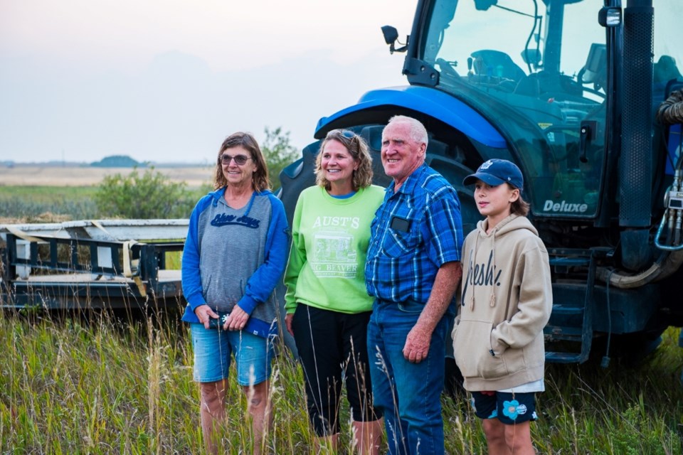 From left, Judy Valentine, Tammie Riddell, Jack Wilson and Knox Valentine watched the first harvest take place. 