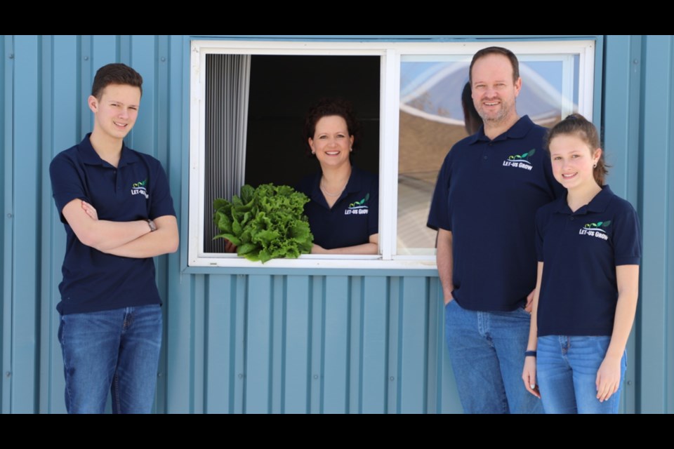 Jan and June Nel operate Let-Us Grow Hydroponics, which provides crops year-round for their facility in Hudson Bay. From left are Eugene Nel, June Nel, Jan Nel and Lize Nel.