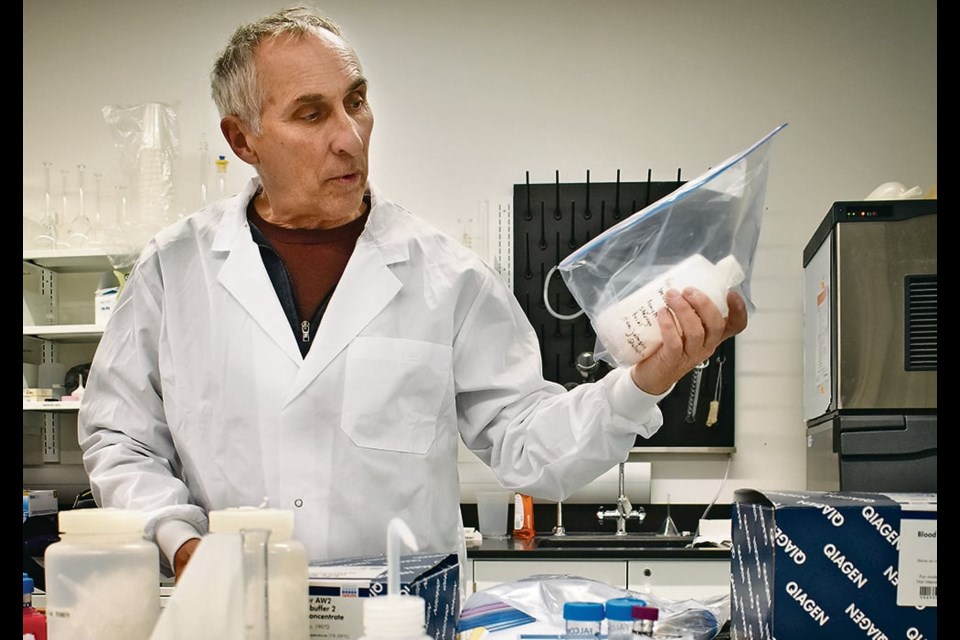 University of Lethbridge professor and researcher Dan Johnson holds a sample of the bio-pesticide he and his colleagues developed about 10 years ago that proved effective in grasshopper control. Despite several efforts, the treatment has never been commercialized. 