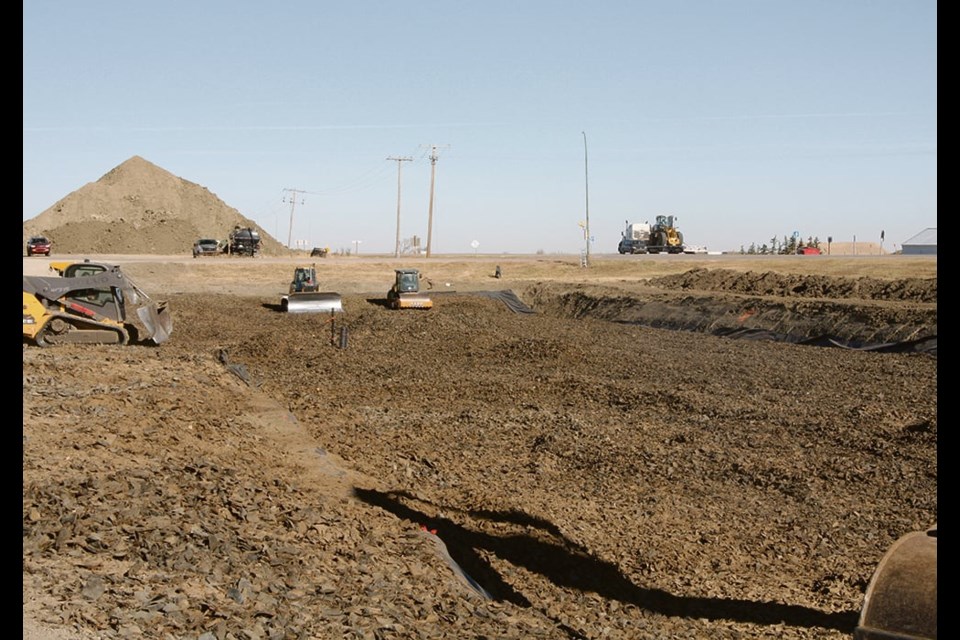Contractors recently expanded an old dugout and filled it with tire derived aggregate on John Metz’s property at Corinne, Sask. The project is preparation for twinning Highway 6. | 
