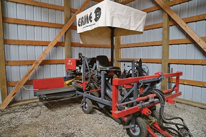 A garlic harvester sits in a corner of the farm shop.