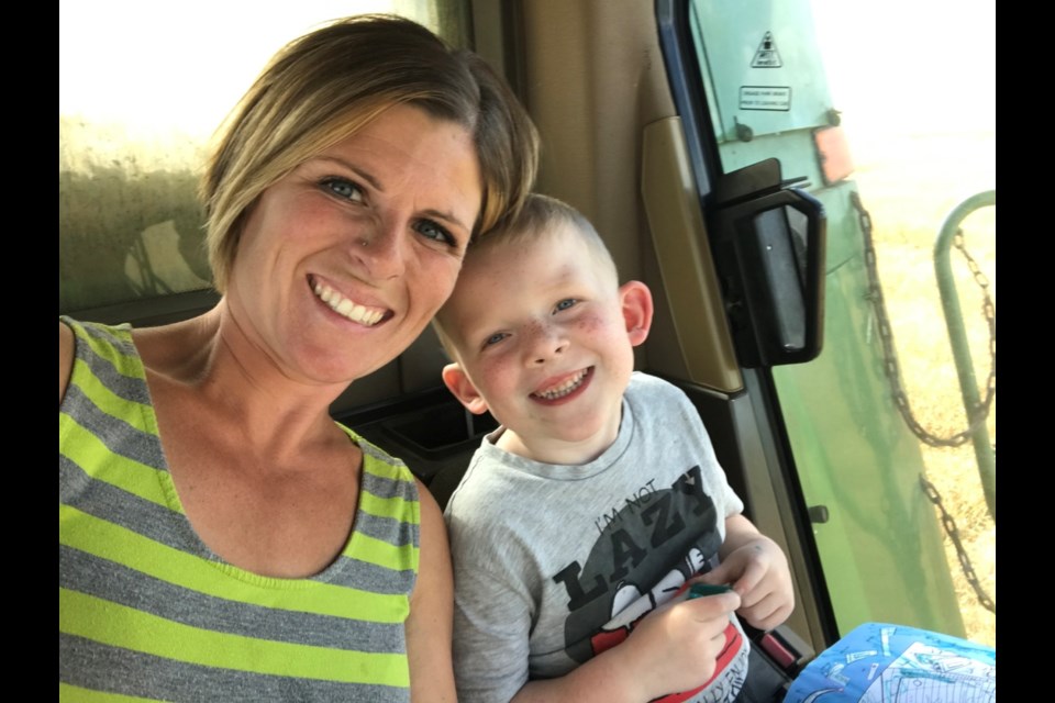 Jennelle Wimmer had to take the farm in her hands to save it for her kids, and quite often the boys, Brayden and Jaxon Wimmer (pictured here), had to be with her in the tractor. 