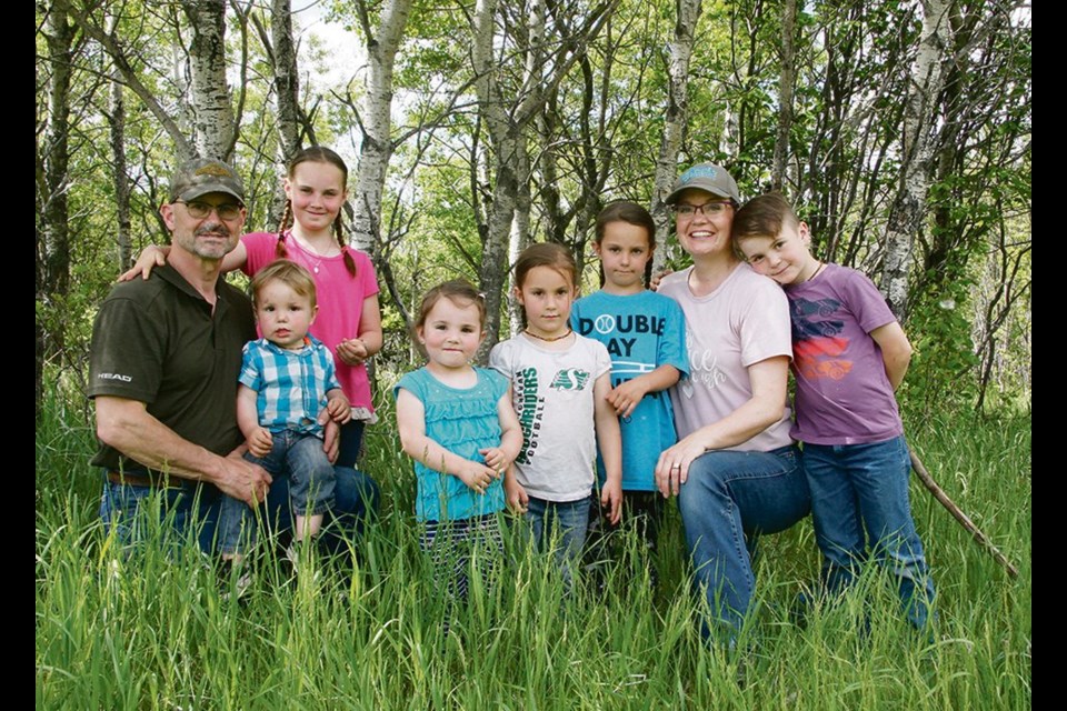 The Cayer family at 7Cs Farms near Balgonie, Sask: Andre, baby Andre, Anika, Sophia, Veronica, Katriona, Lauren and Lochlan. 