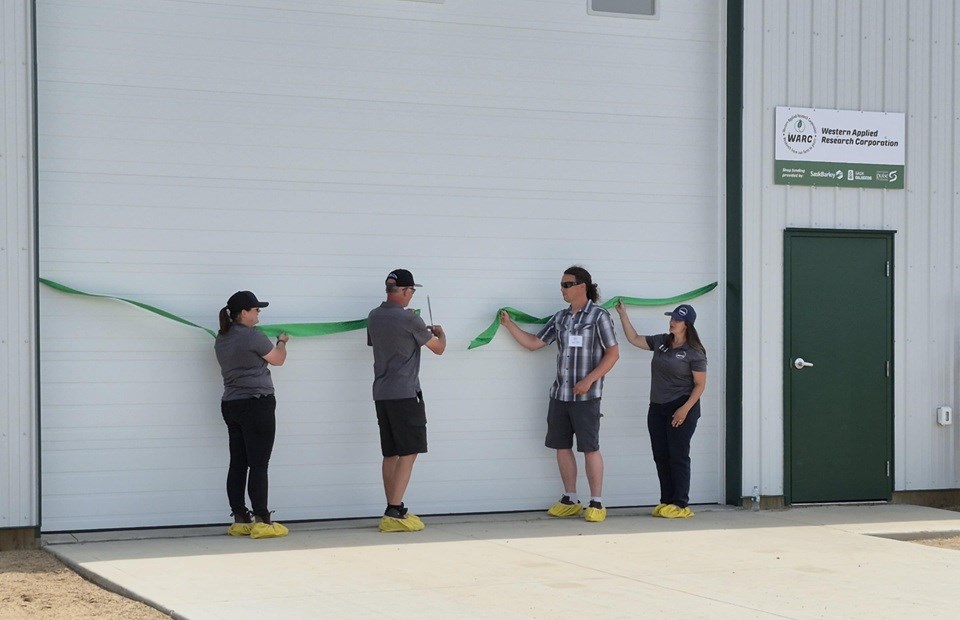 Kayla Slind, Eric Johnson, Jason Veikle and Jessica Enns officially opened the WARC facility July 9.