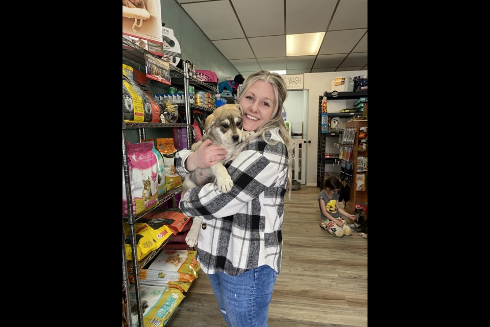 Former Unity resident, Daphne Boser, enjoys her experience at the adoption event at Wiggles and Whiskers Pet Supply held April 30 in Unity.