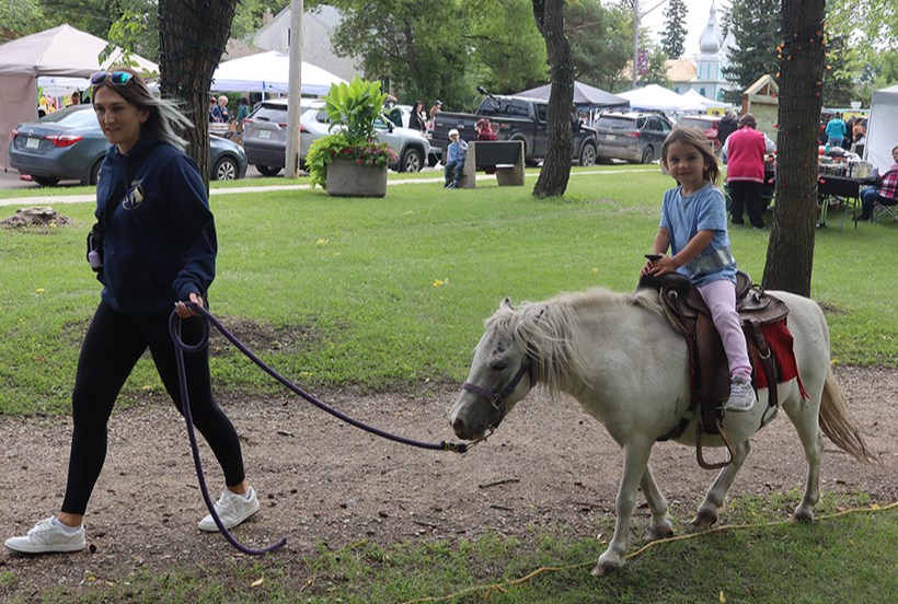 Youngsters were eager to experience the pony ride at the Good Spirit Lake Petting Zoo during the Canora Homecoming and Street Festival.