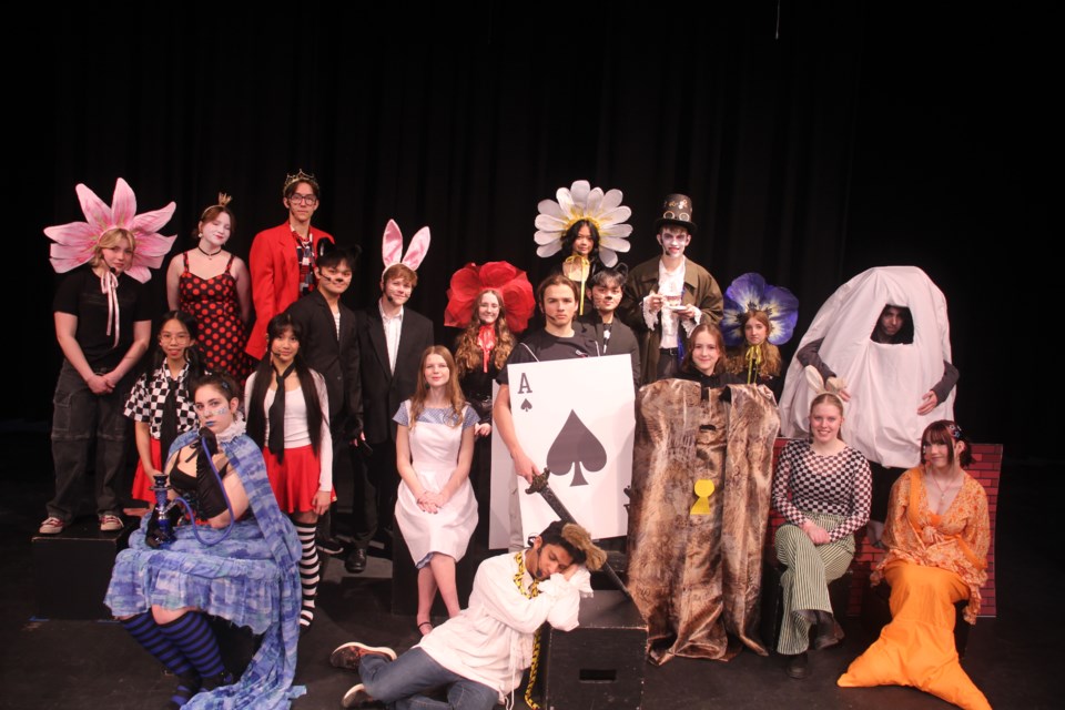 Some of the cast of ‘Alice @ Wonderland’ gather at the Weyburn Comprehensive School during a dress rehearsal held March 30. In the back row, from left, are Lily – Chelsea MacNeill, Queen of Hearts – Hayden Black, King of Hearts – Maximus Kilback, Daisy – Princess Dumagat, and Mad Hatter – Jonas Burdan. In the middle row, from left, are Tweedledee – Daphne Asuncion, Tweedledum – Xhannelle Ebol, Cheshire Cat – Gian Zagada, White Rabbit – Alex Paskiewicz, Rose – Jersey Buehler, Queen’s Guard – Markuss Skujins, Cheshire Cat – Niegel Zagada, Door – Beth Hamel, Violet – Elizabete Sirante, and Humpty-Dumpty – Jayden Stang. In the front row, from left, are Caterpillar – Aaralea Strubey-Lark, Alice – Harper Williams, Dormouse – Haroun Joe Matthews, March Hare – Ella Leko, and Fish – Salem Bell.