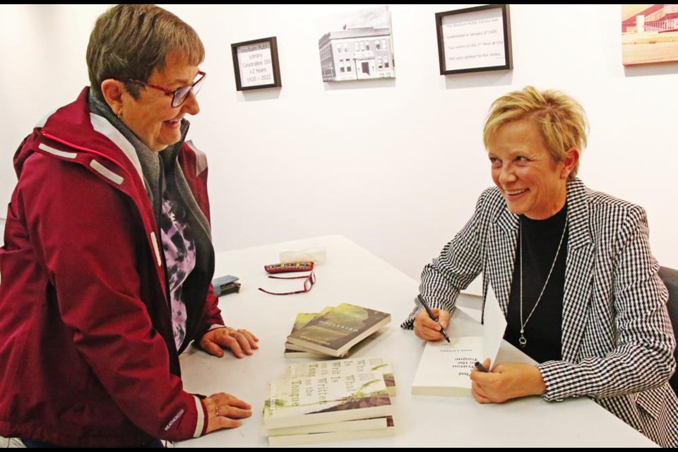 Sherry Klemmer had her copy of the book, What is Written on the Tongue, signed by author Anne Lazurko at an event held at the Weyburn Public Library last October.