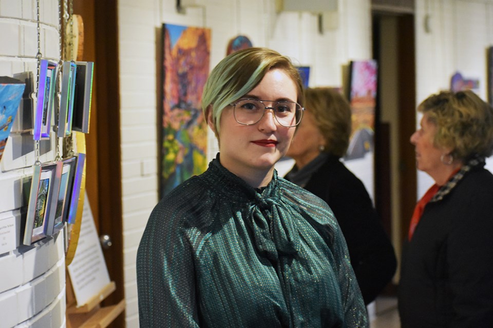 Alexi Anseth pictured in the Chapel Gallery as her first solo exhibition, Just Another Day, hangs in the windows gallery.