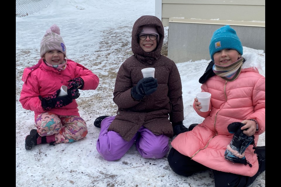 Burke, Kensi, and Emery get warmed up with hot-chocolate.